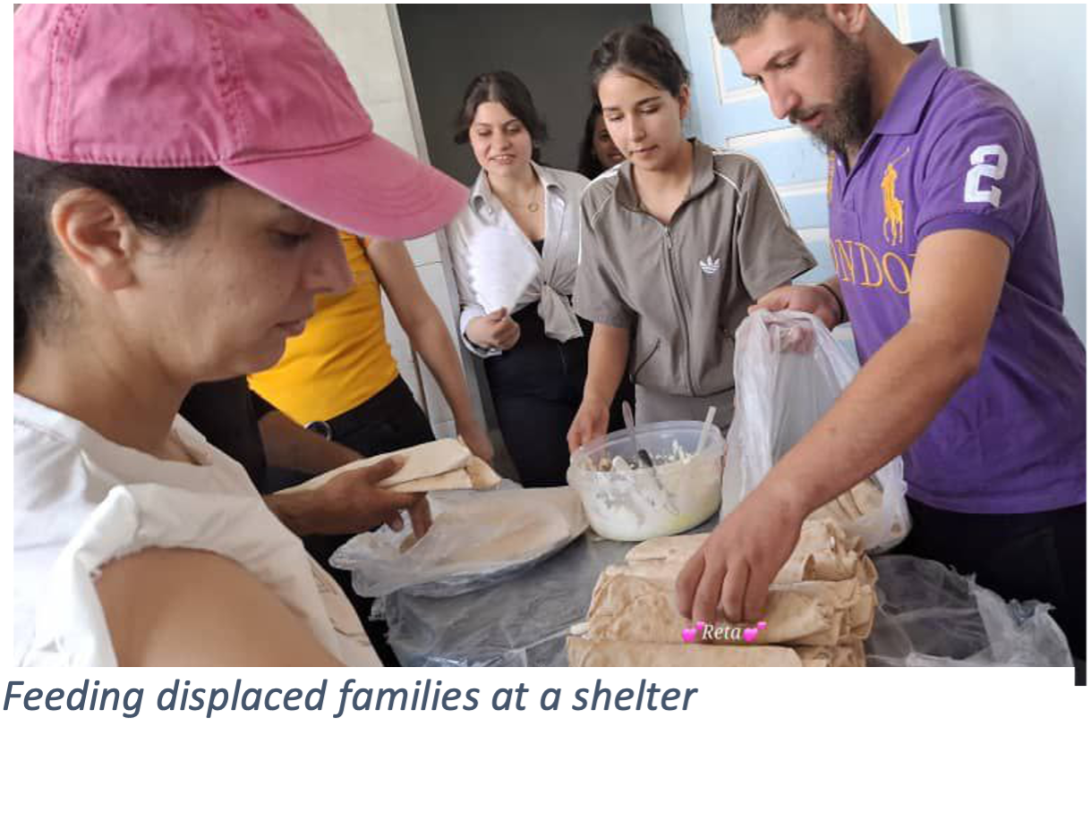 Feeding displaced families at a shelter
